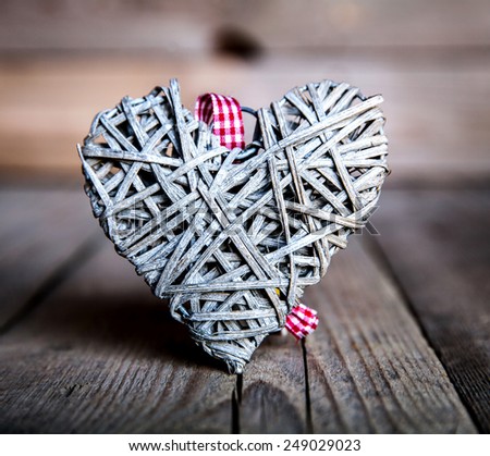 Gray heart on a wooden background. Red, Valentine's Day, Day of the enamored