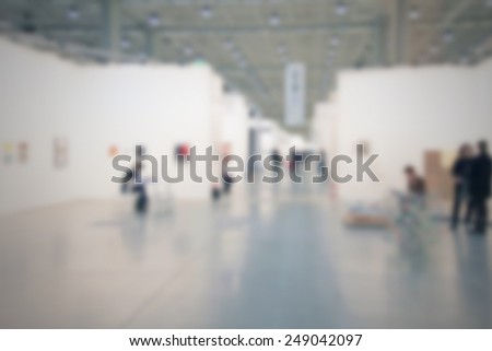 People at a art gallery. Intentionally blurred post production.
