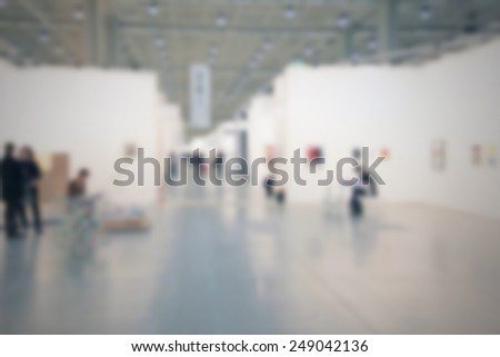 People at a art gallery. Intentionally blurred post production.