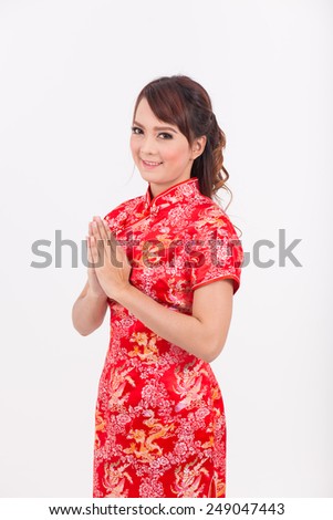 Asian girl greeting in Traditional Chinese, Welcome, Guest, put the palms of the hands together in salute. thai, new year