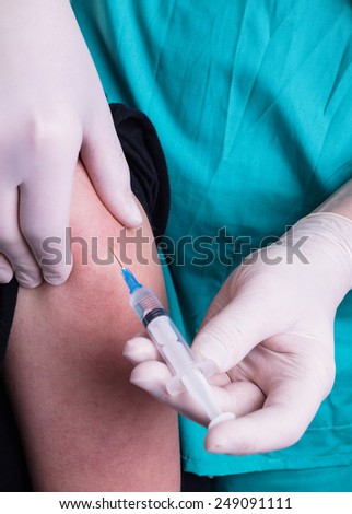 Administer Injection - Flu Shot by the Doctor