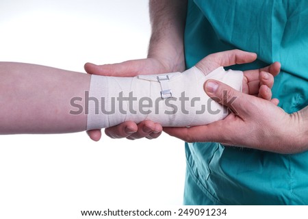 Sprained hand, Doctor helping with the Bandage