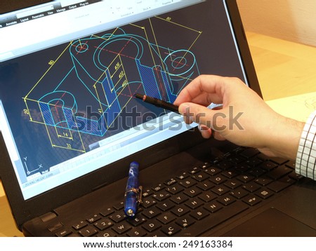 designer working on a cad blueprint    Royalty-Free Stock Photo #249163384