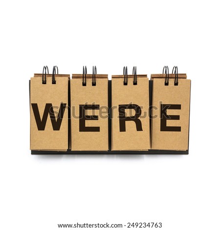 Flip craft paper card with text "WERE". Isolated on a white background.