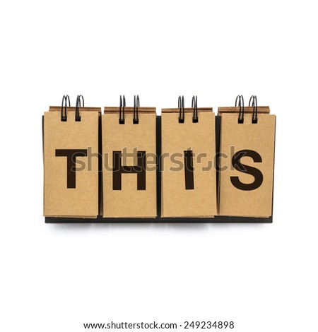 Flip craft paper card with text "THIS". Isolated on a white background.