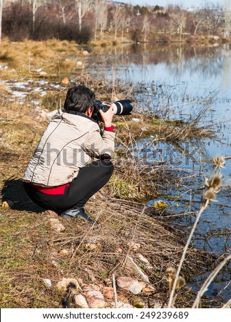 Nature Photographer taking pictures outdoors during hiking trip on  Toros Mountain