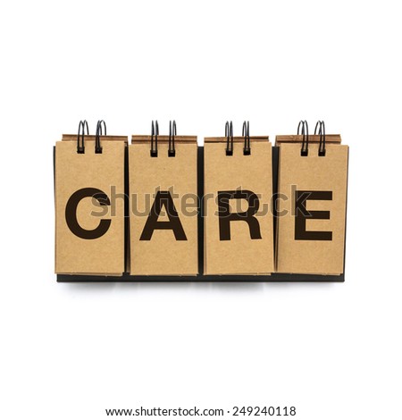Flip craft paper card with text "CARE". Isolated on a white background.