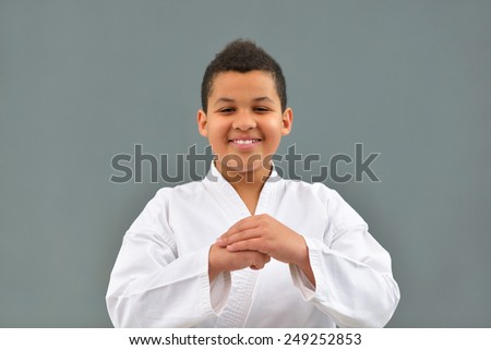 young and successful karate kid in karate positions