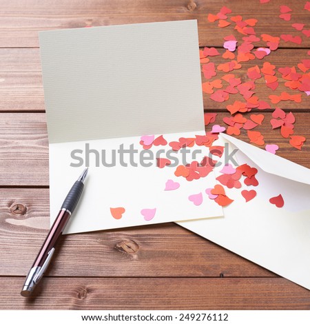 Empty copyspace valentine card or love letter composition over the wooden boards covered surface Royalty-Free Stock Photo #249276112