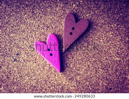 wooden hearts on a wooden background. vintage style