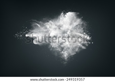 Abstract design of white powder cloud against dark background Royalty-Free Stock Photo #249319357