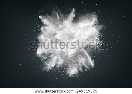 Abstract design of white powder cloud against dark background Royalty-Free Stock Photo #249319375