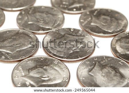 Silver Half Dollar Coins Spread Out on White 