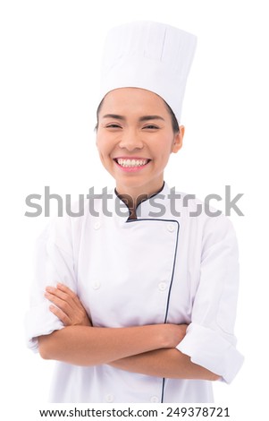 Joyful chef with crossed arm looking at the camera
