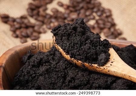 closeup detail of coffee ground in wooden bowl Royalty-Free Stock Photo #249398773