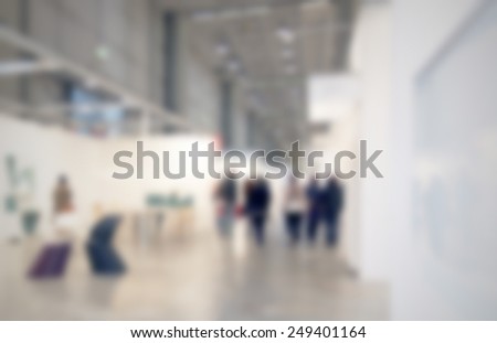 Exhibition art gallery background, location, works and people not recognizable. Intentionally blurred post production background.