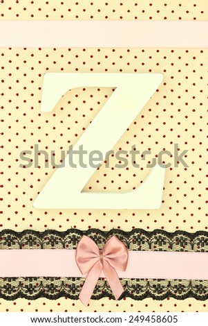Wooden letter Z on polka dots background
