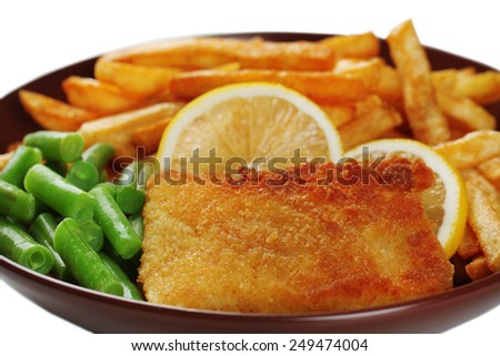 Breaded fried fillet and potatoes with asparagus and sliced lemon on white background