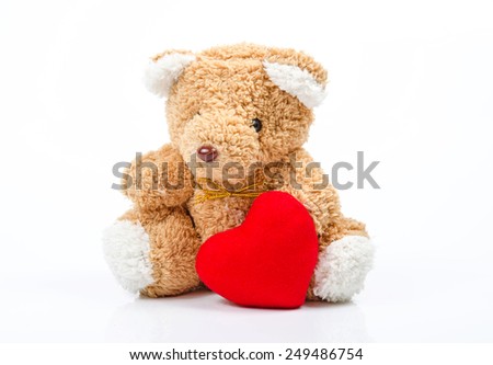 Teddy bear with red Heart on white background