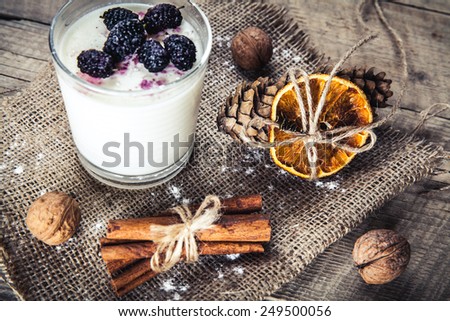 Healthy breakfast - Dairy yogurt with raspberry, mulberry on wooden background. Delicious food. dessert