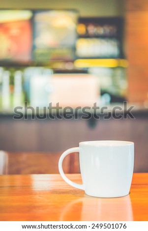 Coffee cup in coffee shop - vintage effect style picture