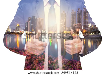 Double exposure of businessman with cityscape