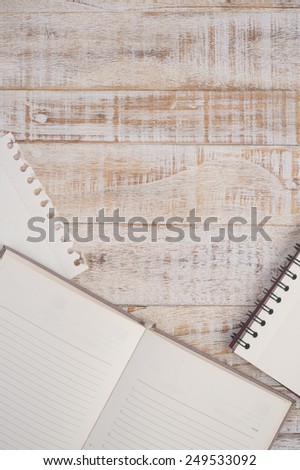 Notebook on wood table for text and background