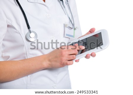 Woman doctor using a tablet on a white background