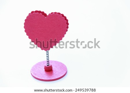 pink wooden heart peg on white background for Valentine day