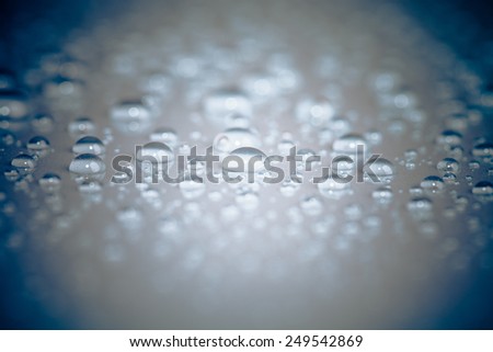 Drops of water on the surface. Shallow depth of field