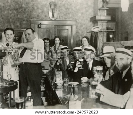 Men enjoying 3.2% beer on the 4th of July in Bangor, Maine, 1933. Royalty-Free Stock Photo #249572023