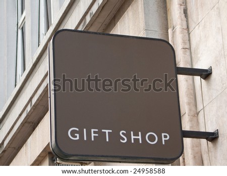 Gift shop sign on wall of traditional building