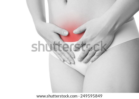 Pain in the abdomen. A girl in black panties.  Isolated on white background.