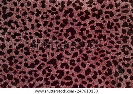 Red leopard pattern. Spotted animal print as background.