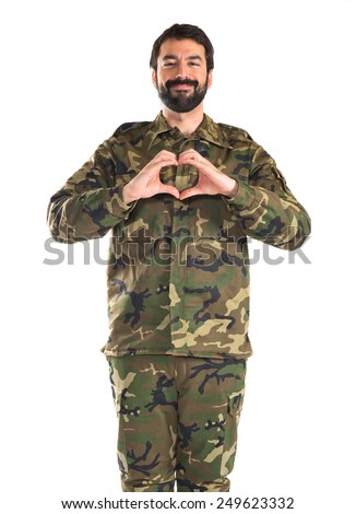 Soldier making a heart with his hands 