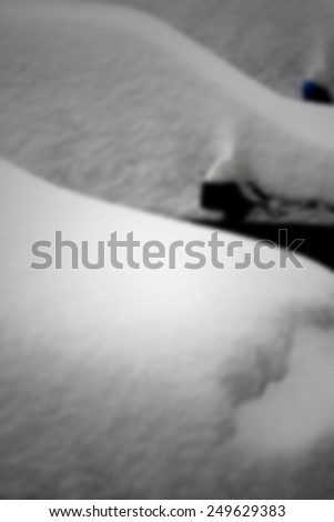 Cars under snow. Intentionally blurred post production background.