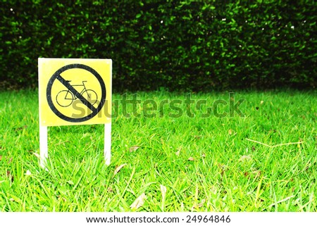 sign of prohibit bicycle on green background