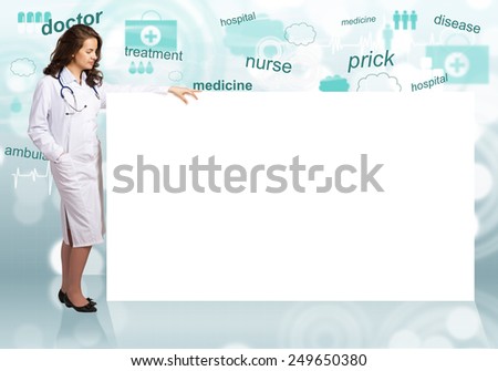 Young pretty woman doctor with white blank banner