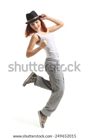 Young beautiful sports woman dancing on a white background. Modern dances.