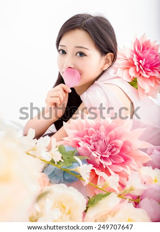 Asian woman in flower with petal