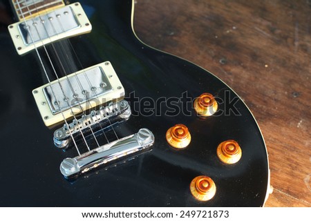 Vintage electric guitar on wood table