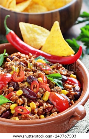 Chili con carne and fresh vegetables.Selective focus.