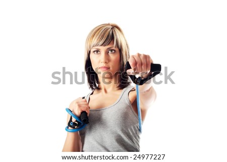 Sportswoman exercising with a resistance band. Solid white background.