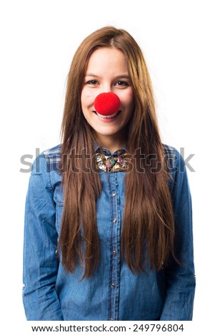 Trendy young woman with a red nose smiling. Over white background