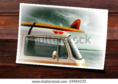 Wooden table with old photographic print of a van with a surfboard
