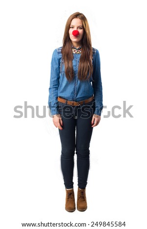 Trendy young woman with clown nose. Over white background