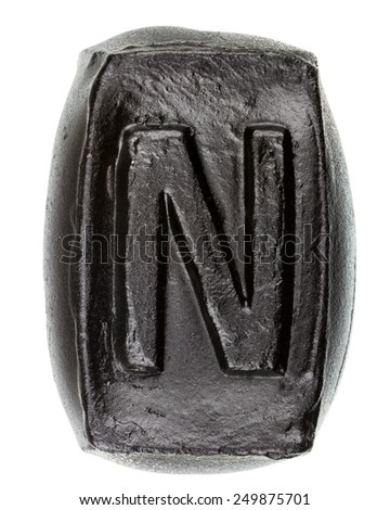Handmade ceramic letter N painted in black isolated on white