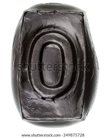 Handmade ceramic letter O painted in black isolated on white