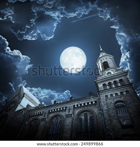 Halloween background with spooky and ancient church over smoky background