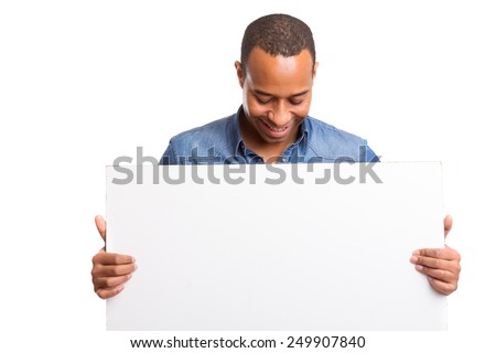 Handsome african business man presenting your product Royalty-Free Stock Photo #249907840